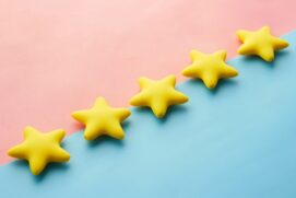a row of yellow stars sitting on top of a blue and pink surface {{brizy_dc_image_alt imageSrc=